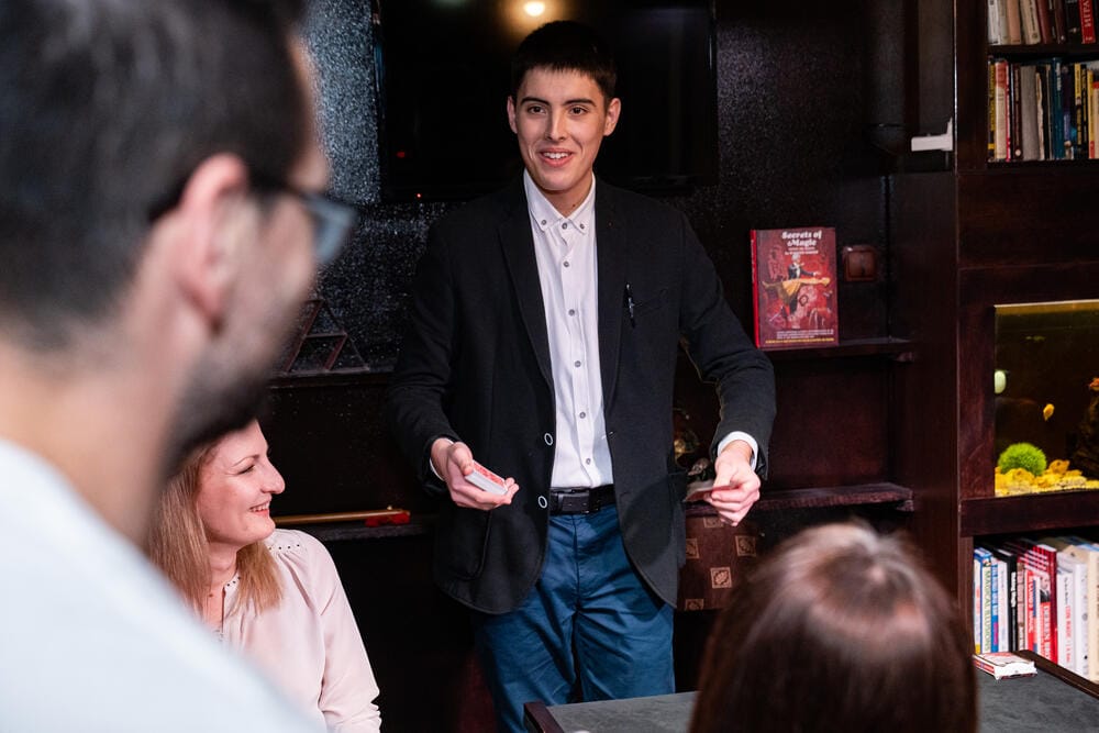 Rado Sheytanoff performing close-up for guests at a live show