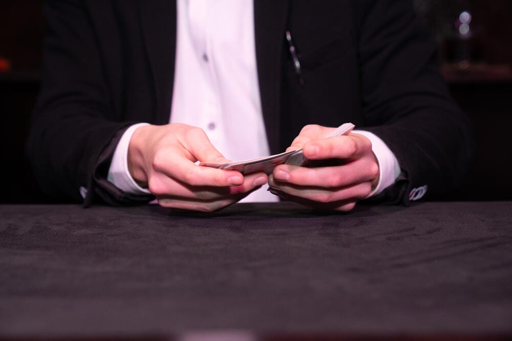Close-up of Rado Sheytanoff shuffling a deck of cards